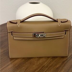 H inspired. K Pochette Tan Leather Handbag